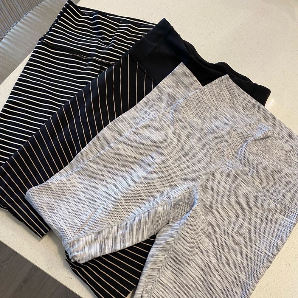 3 Pairs of Lululemon Athletica Leggings.  Size 4, 28”.  Never worn, tags removed